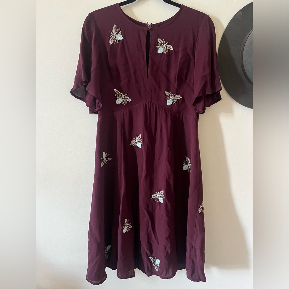 Small, dark red Anthropologie dress with bead detail